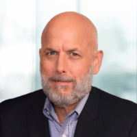 Russ Ashley a man wearing a suit and tie